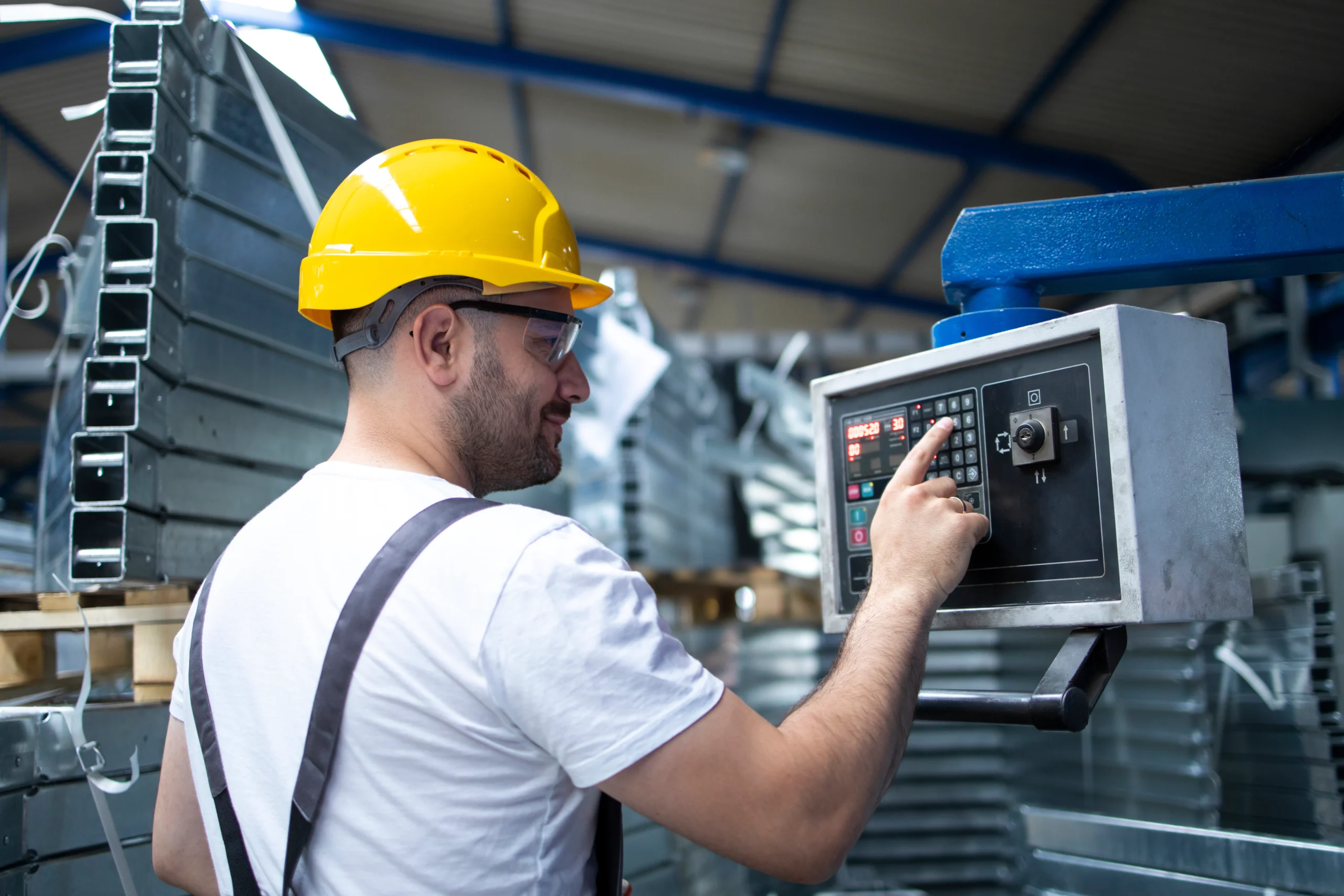 factory-worker-operating-industrial-machine-setting-parameters-computer factory-worker-operating-industrial-machine-setting-parameters-computer